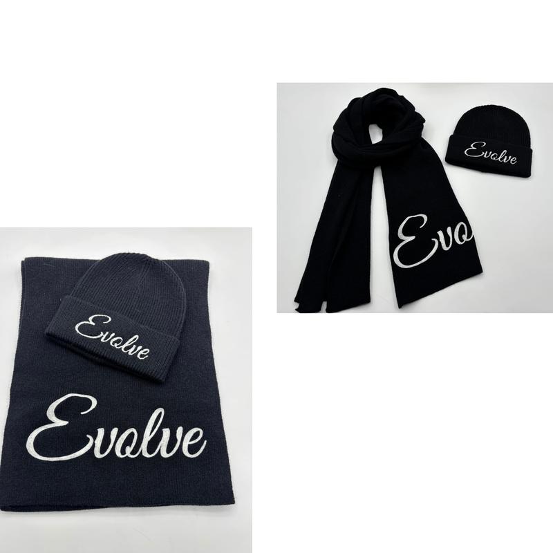Black knitted beanie hat and matching scarf set with white cursive Evolve embroidery, shown flat and styled