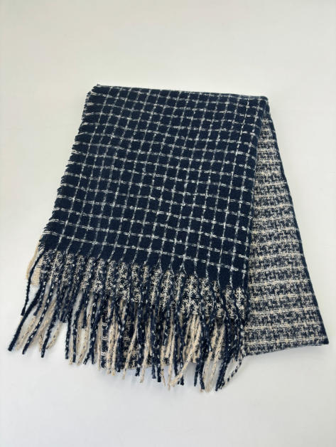 Folded navy blue and cream woven check scarf with long fringe trim, flat lay on white background