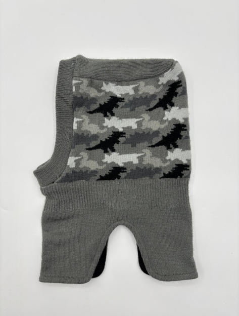 Grey knit balaclava laid flat showing black white grey camouflage jacquard pattern on front panel with ribbed edges