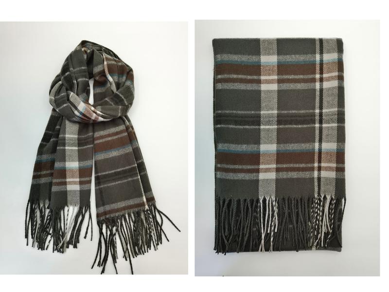 Olive green tartan plaid scarf with brown, white and blue stripes, shown draped and folded with fringe ends