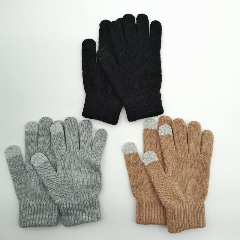 Three pairs of knit touchscreen winter gloves in black, grey, and beige laid flat on white background