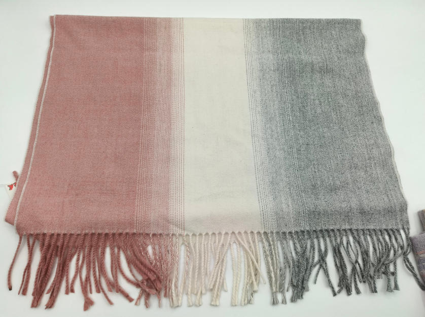 Soft woven scarf with ombre color block stripes in dusty pink, cream, and grey with twisted fringe trim