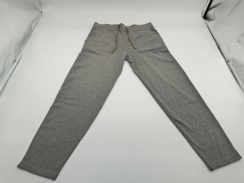 Flat lay of grey marl slim tapered jogger sweatpants with brown drawstring waistband and side pockets