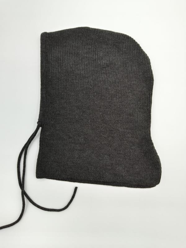Dark charcoal ribbed knit balaclava hood laid flat on white background, featuring black drawstring ties on the left side