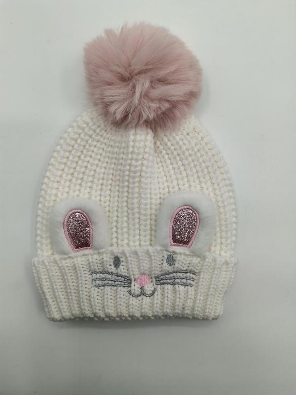 White chunky knit children's beanie hat with pink glitter bunny ears, embroidered whiskers, and large pink faux fur pom-pom on top
