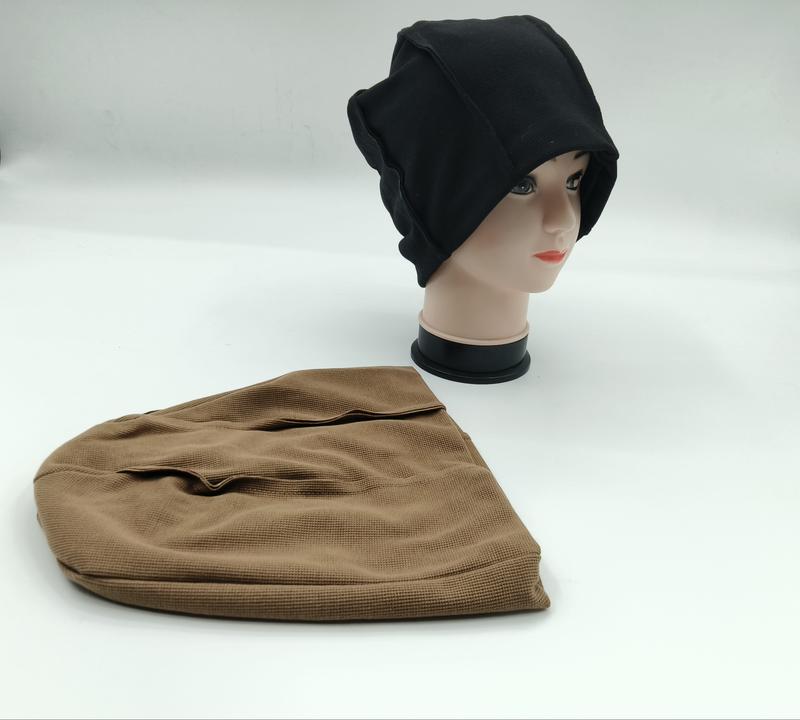 Black waffle knit slouchy beanie on mannequin head with matching brown beanie laid flat on white background