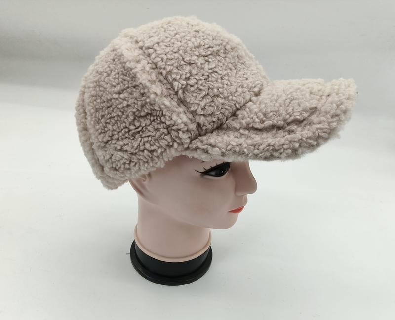 Cream beige sherpa fleece baseball cap with structured brim displayed on a mannequin head, side view