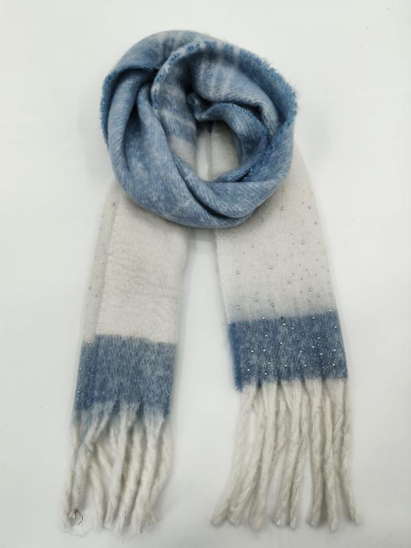 Soft blue and cream plaid winter scarf with pearl beads and fringe ends, coiled and laid flat on white background