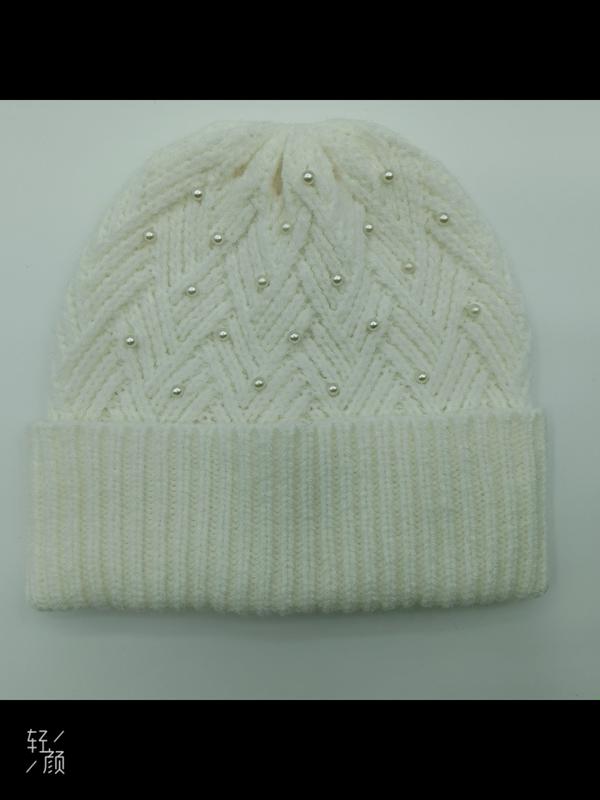 Cream white chunky knit beanie hat with chevron zigzag pattern and scattered pearl bead embellishments, folded cuff