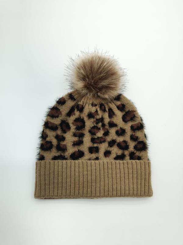 Camel brown leopard print knitted beanie hat with fluffy faux fur pom-pom on white background