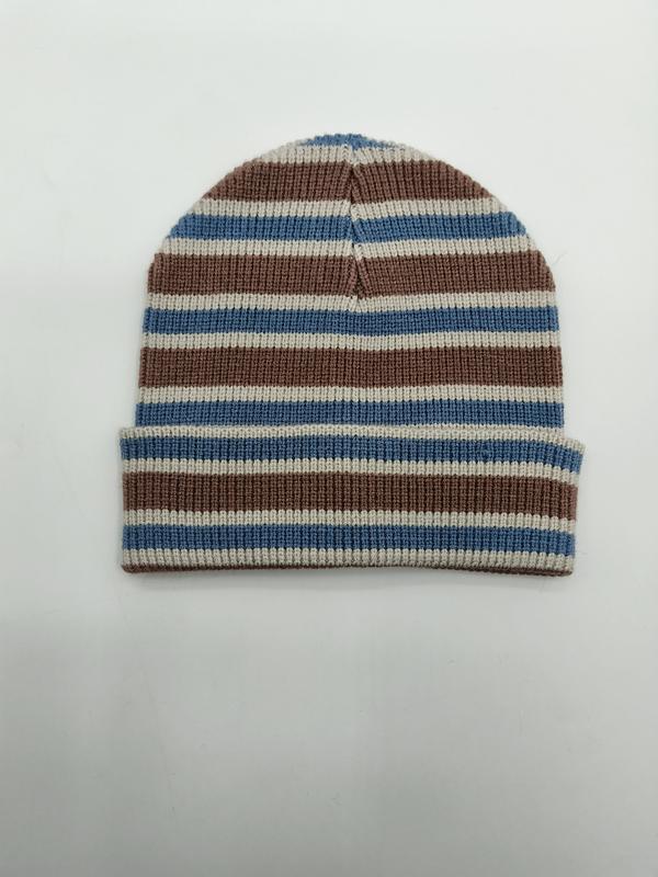 Ribbed knit beanie hat with horizontal blue, brown, and cream stripes and folded cuff, laid flat on white background