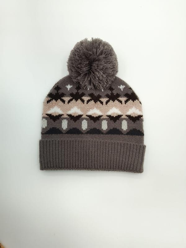Gray knit winter beanie hat with Fair Isle Nordic pattern in pink, brown, and white, featuring a fluffy gray pom-pom on top