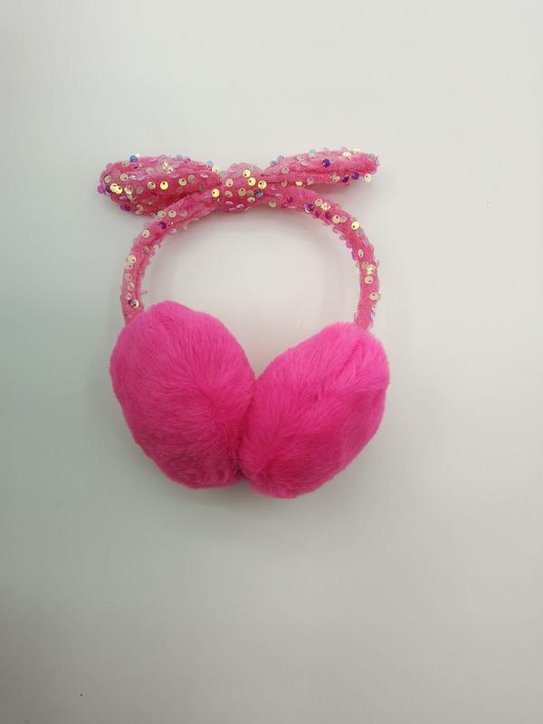 Hot pink fluffy winter earmuffs with sparkly sequin-covered pink bow headband on white background